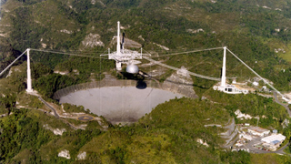 Illustration for article titled A Magically Surreal Symbol of Human Ingenuity: Scientists Reflect on Arecibo’s Doomed Big Dish